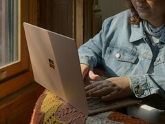 Person using a Microsoft Surface laptop by a window (Image source: Surface on Unsplash)