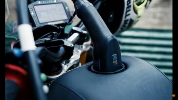 The gargantuan seat cleverly hides the charging port and hardware where the tank would be while providing a comfortable place to sit. (Image source: Royal Enfield on YouTube)