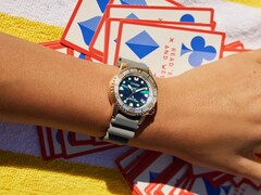 The dial shifts between deep blue, teal, and violet tones depending on the light.