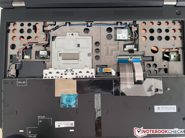 RAM, WWAN, and Wi-Fi module underneath the keyboard