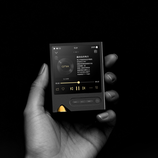 The Onix Tocata XM2 DAP, pictured in a hand against a black background. (Image source: Onix)