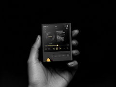 The Onix Tocata XM2 DAP, pictured in a hand against a black background. (Image source: Onix)