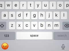 An image of the iOS keyboard with the emoji symbol replaced by the iOS angry emoji.