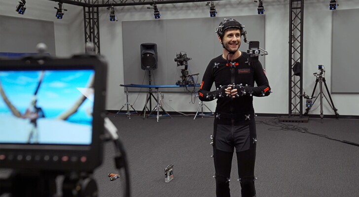 A performance actor uses facial motion capture tools with Unreal Engine in a professional studio setup (Image source: Epic Games via Unreal Engine blog)