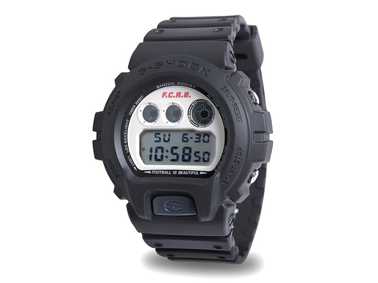 Angled view of the Casio G-Shock DW-6900 x F.C. Real Bristol limited-edition digital watch with a black resin strap and vintage-style off-white dial.