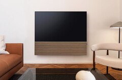 Samsung pairs the S99H OLED Smart TV with a stylish soundbar featuring a wooden front panel.