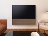 Samsung pairs the S99H OLED Smart TV with a stylish soundbar featuring a wooden front panel.