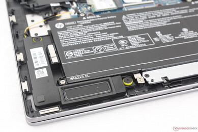 Down-firing stereo speakers near front corners