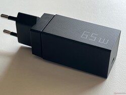 The compact 65-watt power supply gets very hot.