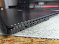 Laptop with barrel connector next to two USB-C ports