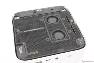 Removing the bottom panel reveals the integrated speakers and metal dust filter plate