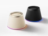 The speaker magnetically clips to the back of a wireless charging phone, including iPhones, and holds it up as a stand.