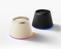 The speaker magnetically clips to the back of a wireless charging phone, including iPhones, and holds it up as a stand.