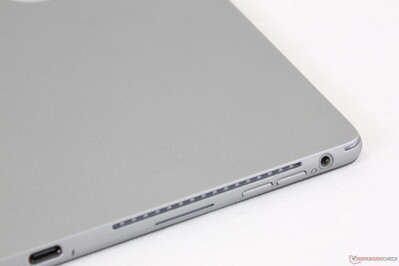 Narrow slits for speaker grilles along two edges of the tablet