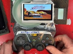 The DIY 'Frankenstein' PlayStation 2 slim portable gaming handheld with an exposed disc drive