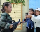 The video for "Huawei Beauty" has everything from a child soldier to bizarre alcohol-related signage. (Source: YouTube/Hong Kong Free Press)