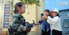 The video for &quot;Huawei Beauty&quot; has everything from a child soldier to bizarre alcohol-related signage. (Source: YouTube/Hong Kong Free Press)