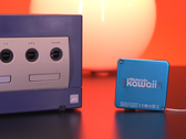 A screengrab showcasing the Nintendo Gamecube next to the tiny keychain-sized Nintendo Kawaii Wii