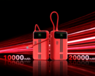 Two red Honor Life power banks with built-in displays and attached USB-C cables
