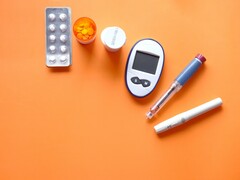 An insulin pen diabetic measurement tools and some medications (Image source: Towfiqu barbhuiya via Unsplash; cropped)