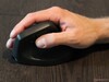 The thumb buttons and scroll wheel are positioned close together