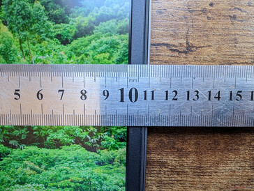 Narrow side bezels with thicker top and bottom bezels