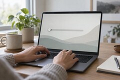 Hands on a laptop keyboard, a slider at the far left on the screen