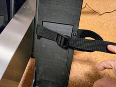 The feet are secured with a strap