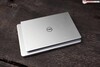Dell Inspiron 13 5310 (2021) on top of a 14-inch laptop