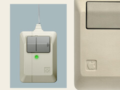 Spigen's new AirPods Pro 3 accessory next to Apple's original Macintosh mouse.