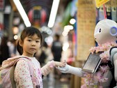 Princeton warns of context manipulation attacks on Web3 AI agents. Pictured: A girl holding a robot's hand (Image source: Andy Kelly, Unsplash)