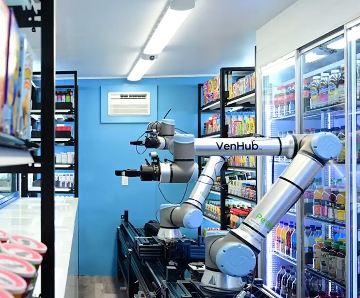 Venhub stores use two AI-powered robots that ride on a long metal track to fill customer orders 24/7. (Image source: Venhub)