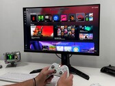 Windows 11 Full Screen Experience (FSE) interface displayed on a monitor with an Xbox controller used for navigation (Image source: YouTube/ETA Prime)