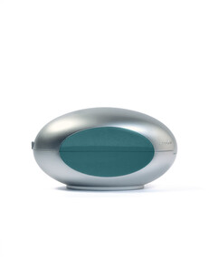Closed silver and teal capsule-shaped collector's case for the Casio G-Shock x C2H4 collaboration.