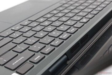 The grilles above the keyboard are actually for ventilation and not for audio