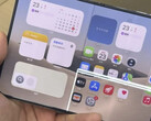 iPhone Duo unfolded with a bright horizontal line across its inner display.