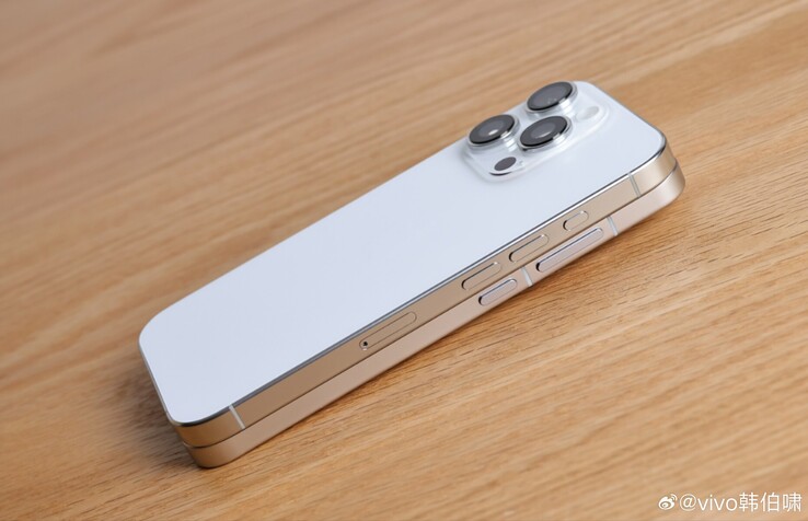 An alleged look at the X200 Pro mini beneath an iPhone 16 Pro. (Image source: Weibo)