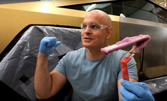 This purple goop contains dissolved gold destined to cover a Tesla Cybertruck. (Image source: JerryRigEverything on YouTube)