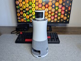 Ricoh Meeting 360 in front of a keyboard and monitor